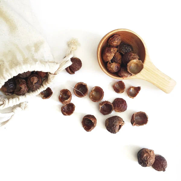 Soap nuts spilling from muslin bag