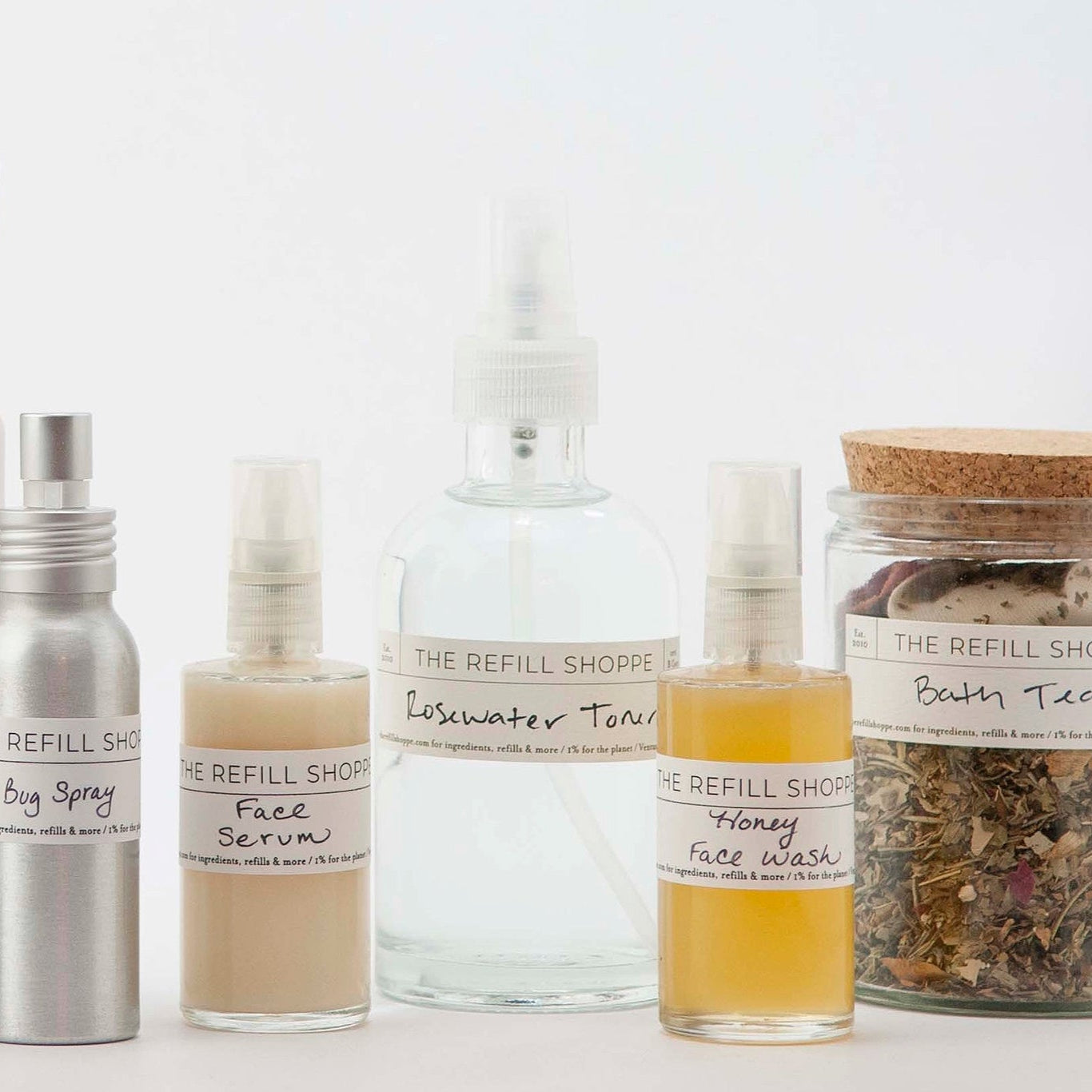 Collection of refillable products from The Refill Shoppe on a white background